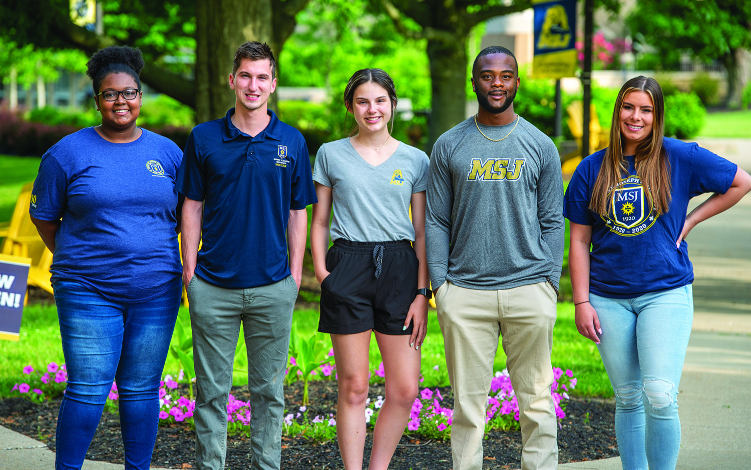 Mount St. Joseph University students smiling in quad.