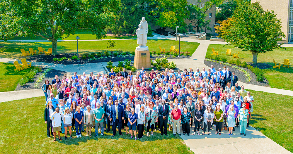 faculty and staff in group photo in msj quad