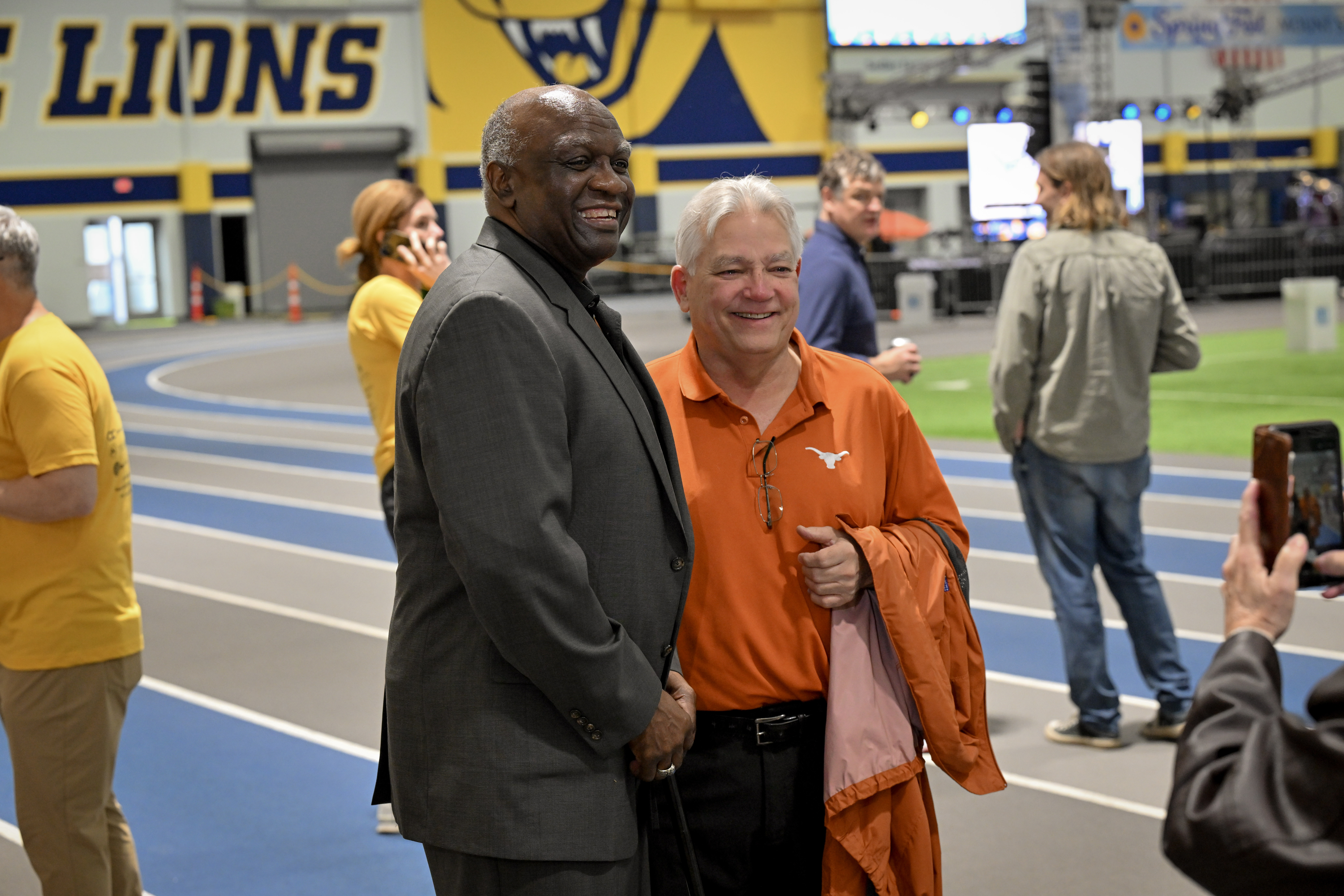 president williams smiling with someone next to him
