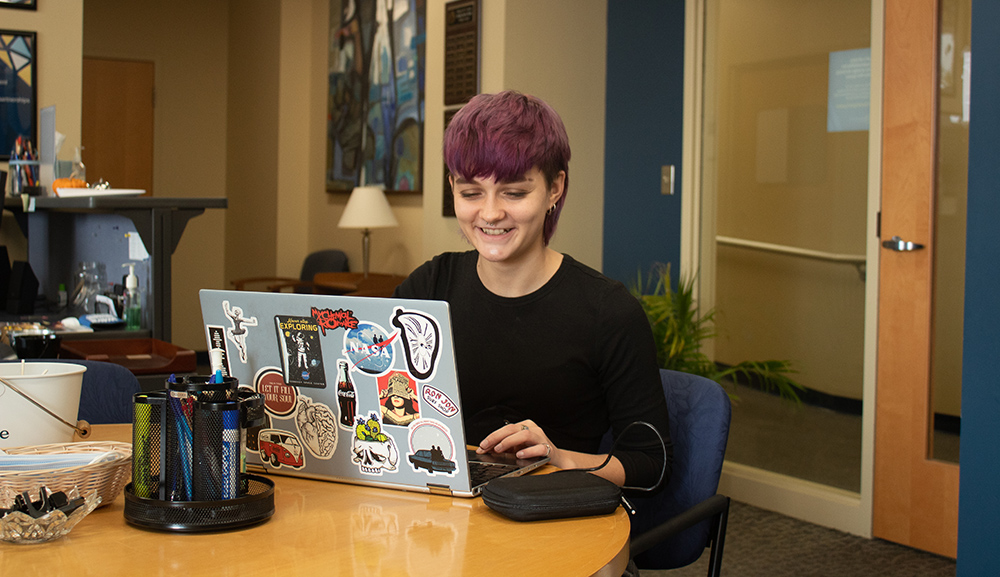female student on laptop in career and experiential education center at mount st. joseph university