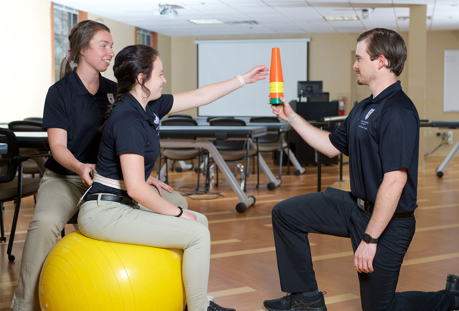 Image of Physical Therapy Students doing a stretching exercise.