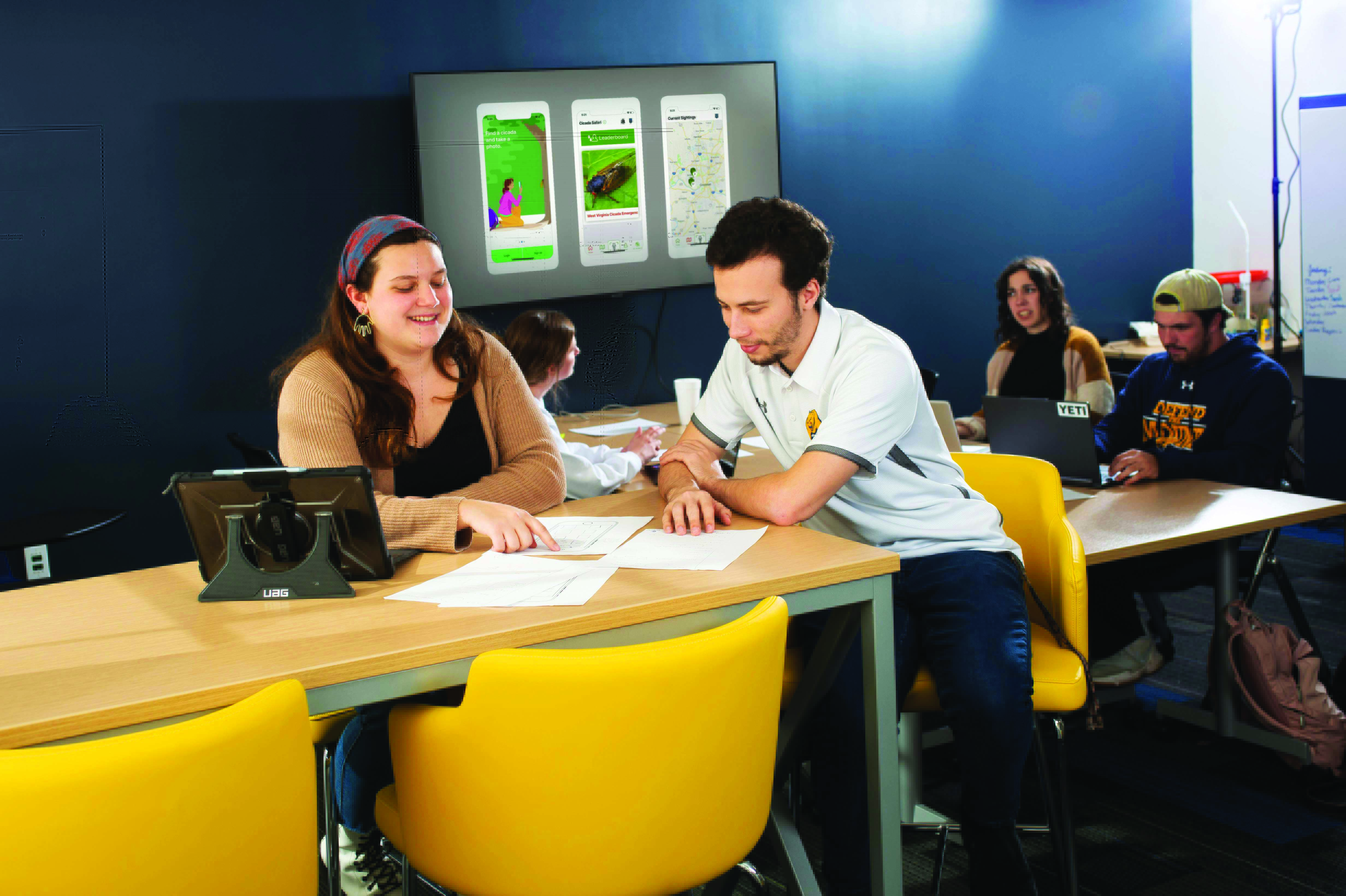 computer science students sitting at a desk