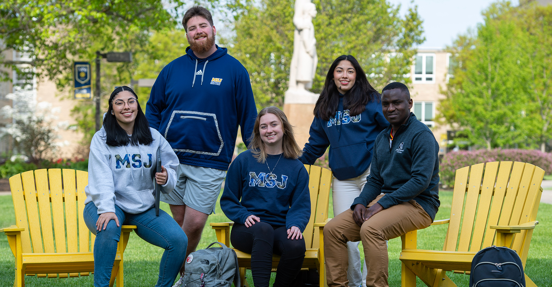 group of students together outside smiling