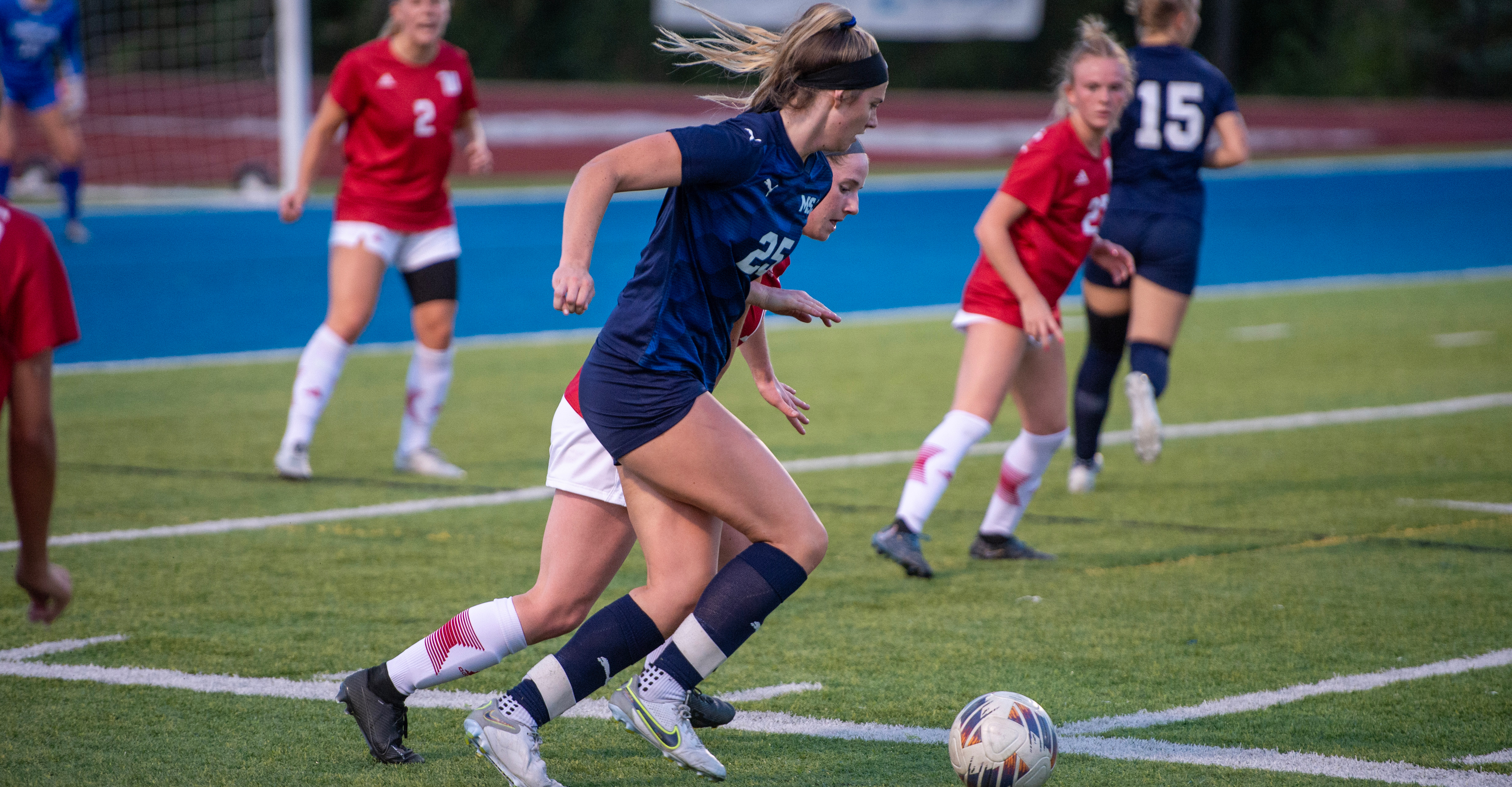 female msj socce player on field