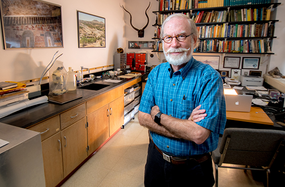 professor gene kritsky standing by a desk