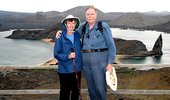 Dr. Davis standing with his wife, mary in front of mountains
