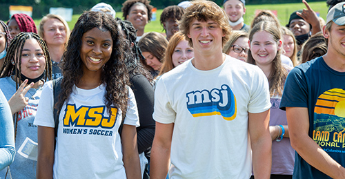 Mount St. Joseph University freshmen in group smiling outside.