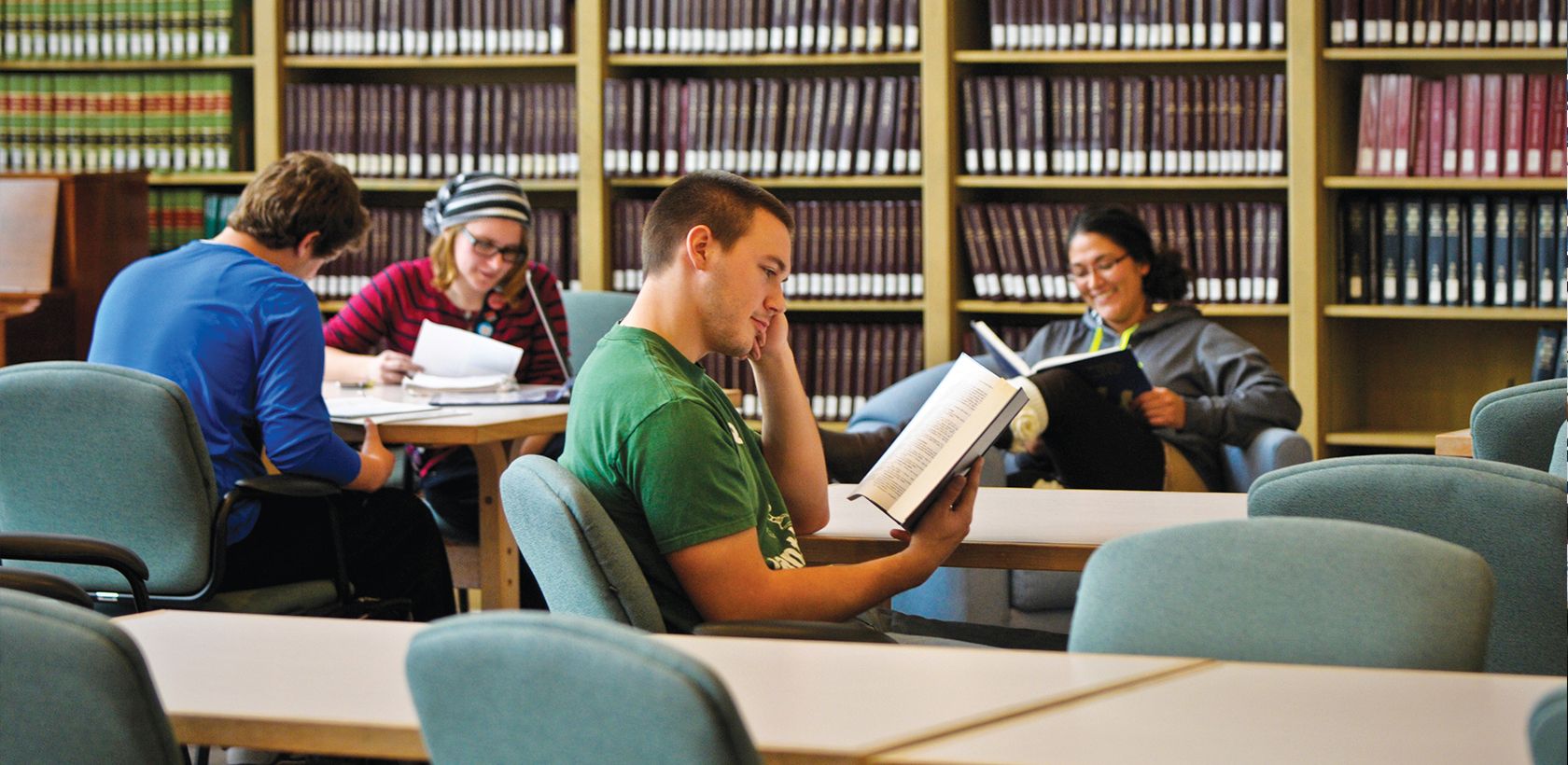 students reading in library